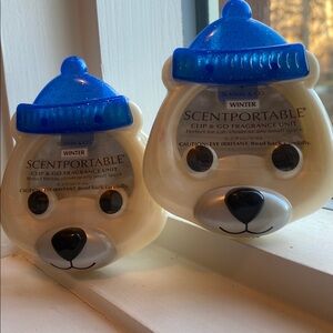 Two Bath & Body Works Scentportable clip and go fragrance units in Winter